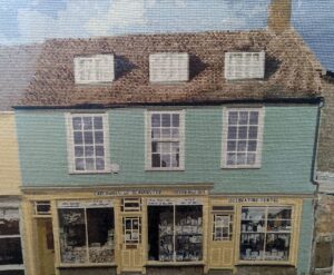 A cross stitch of the shop made by Simons mum Sally