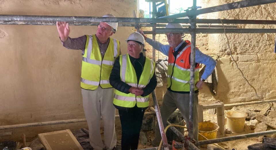Photo of Andrew showing Chair of Dorset council the interior of Tolpuddler Old Chapel