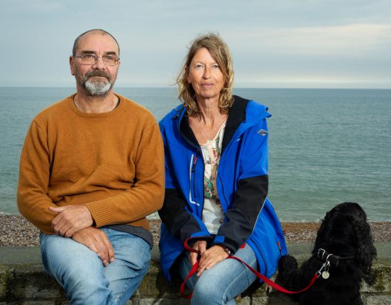 Andy with his friend Karin and Basil the cocker spaniel at the beach Pic Pete Millson