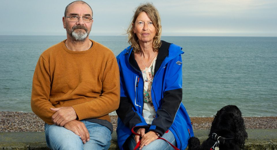 Andy with his friend Karin and Basil the cocker spaniel at the beach Pic Pete Millson