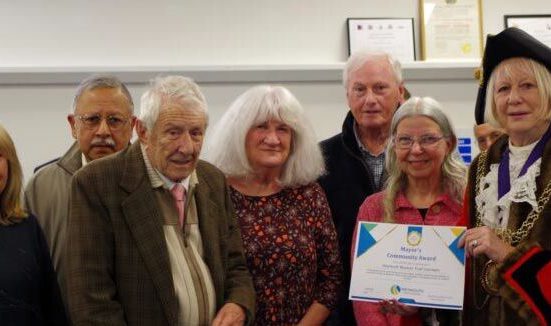 Mayor presents Weymouth volunteers at Weymouth Museum Trust with a Community Award certificate at the 2026 Mayor's Community Awards ceremony