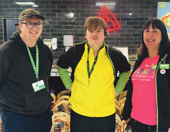 Intern Corey Anstey, centre, with colleagues at Asda Weymouth