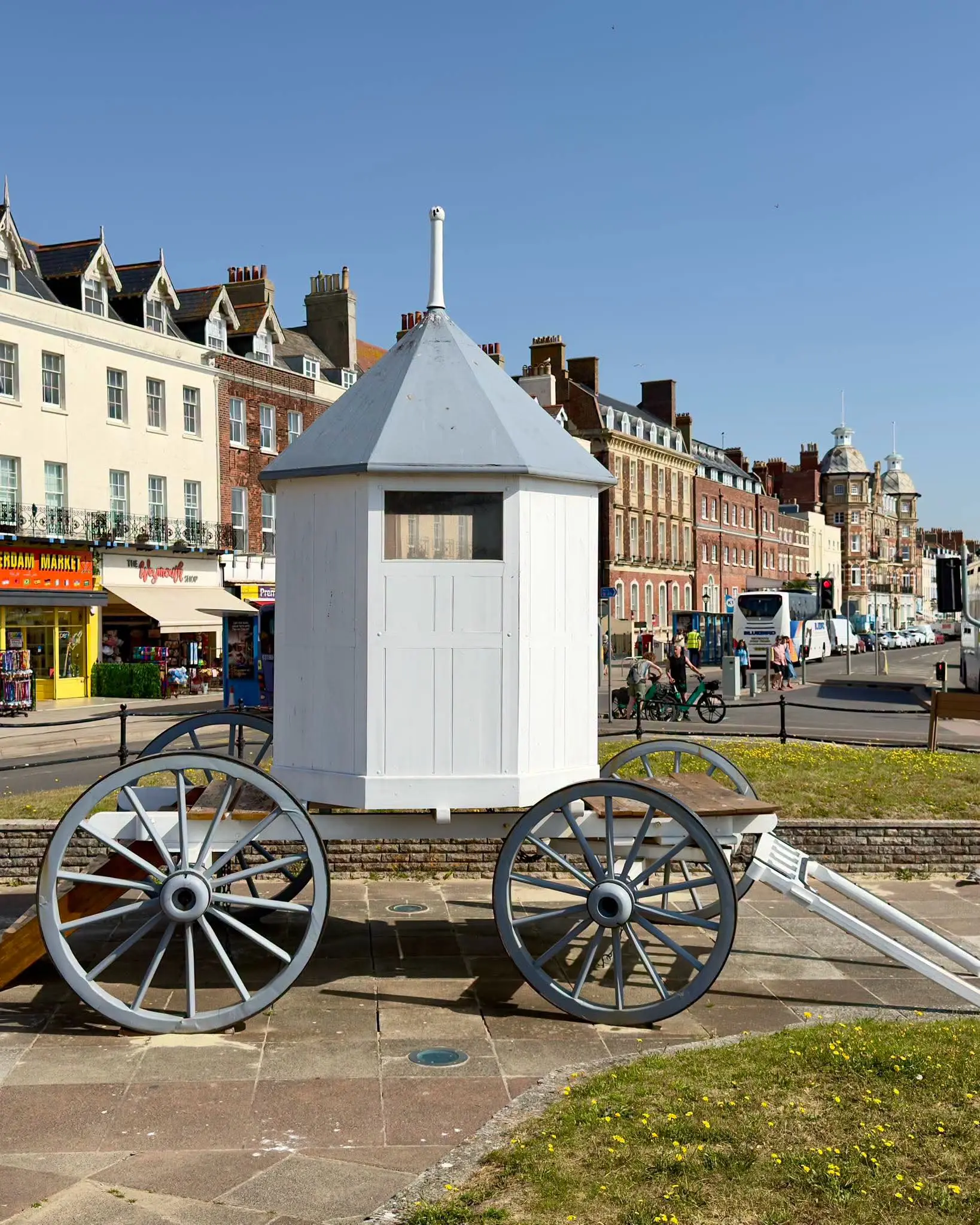 A restored Georgian bathing machine on display along Weymouth's Esplanade, part of the town's heritage trail.