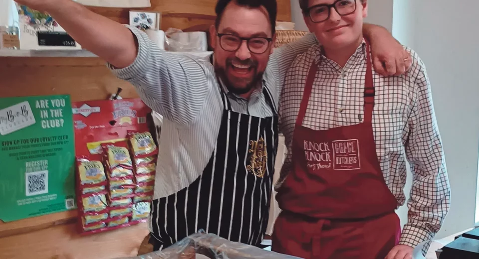 Tobyn Copp, a Dorset Studio School student, works alongside a Brace of Butchers team member in Poundbury