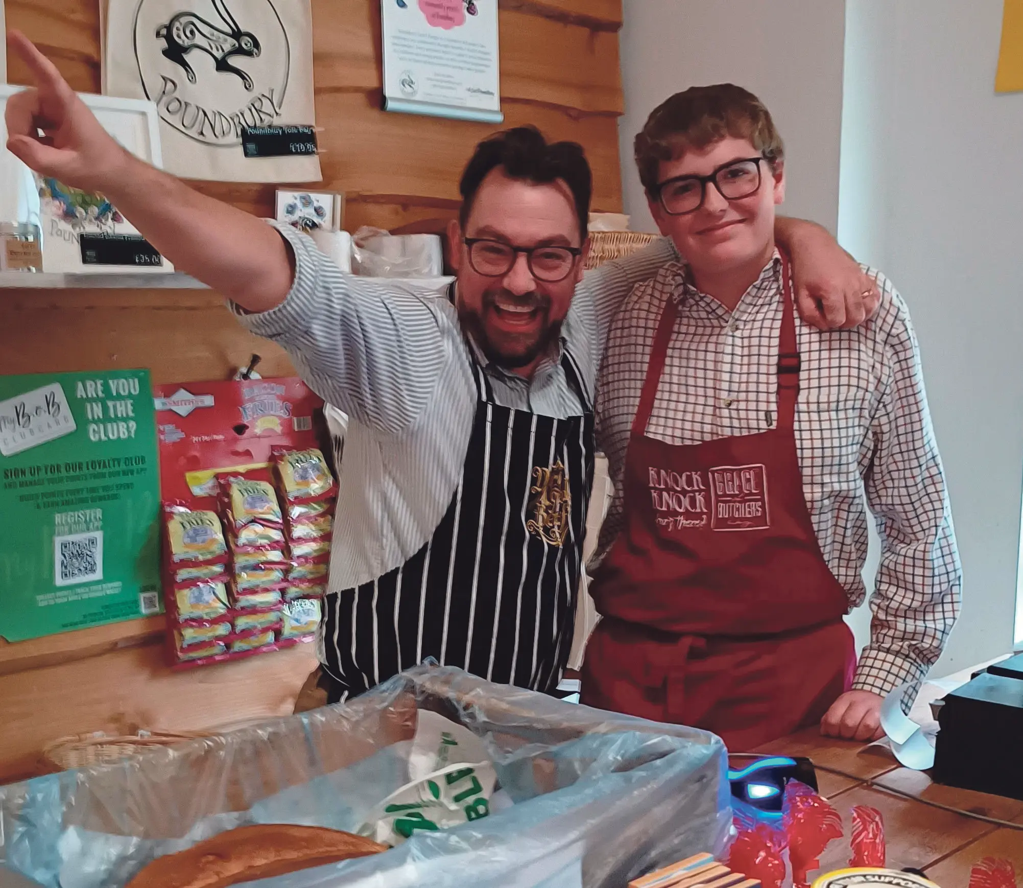 Tobyn Copp, a Dorset Studio School student, works alongside a Brace of Butchers team member in Poundbury