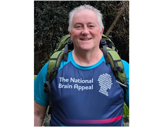 Chris McKenna, 66, from Blandford Forum, wearing a National Brain Appeal running vest and backpack ahead of his 630-mile solo walk for Alzheimer's research.