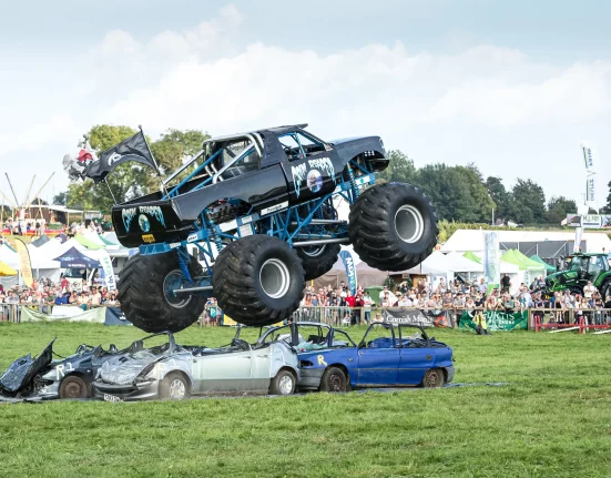 The Grim Reaper monster truck flies over crushed cars in front of a large crowd at Dorset County Show 2026