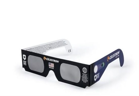 Where to buy solar eclipse glasses in Dorset and the best places to watch: Product photo of Celestron-branded solar eclipse glasses on a white background, black cardboard frames with dark lenses, ISO safety certification logo, American flag and 'Made in USA' marking on one arm