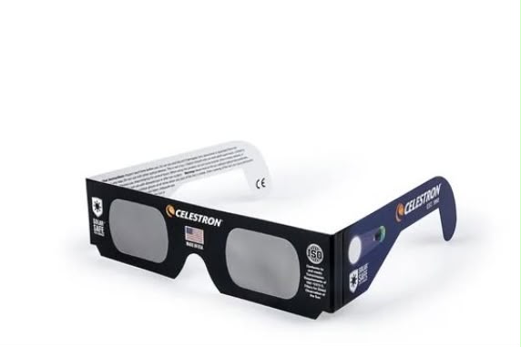 Where to buy solar eclipse glasses in Dorset and the best places to watch: Product photo of Celestron-branded solar eclipse glasses on a white background, black cardboard frames with dark lenses, ISO safety certification logo, American flag and 'Made in USA' marking on one arm