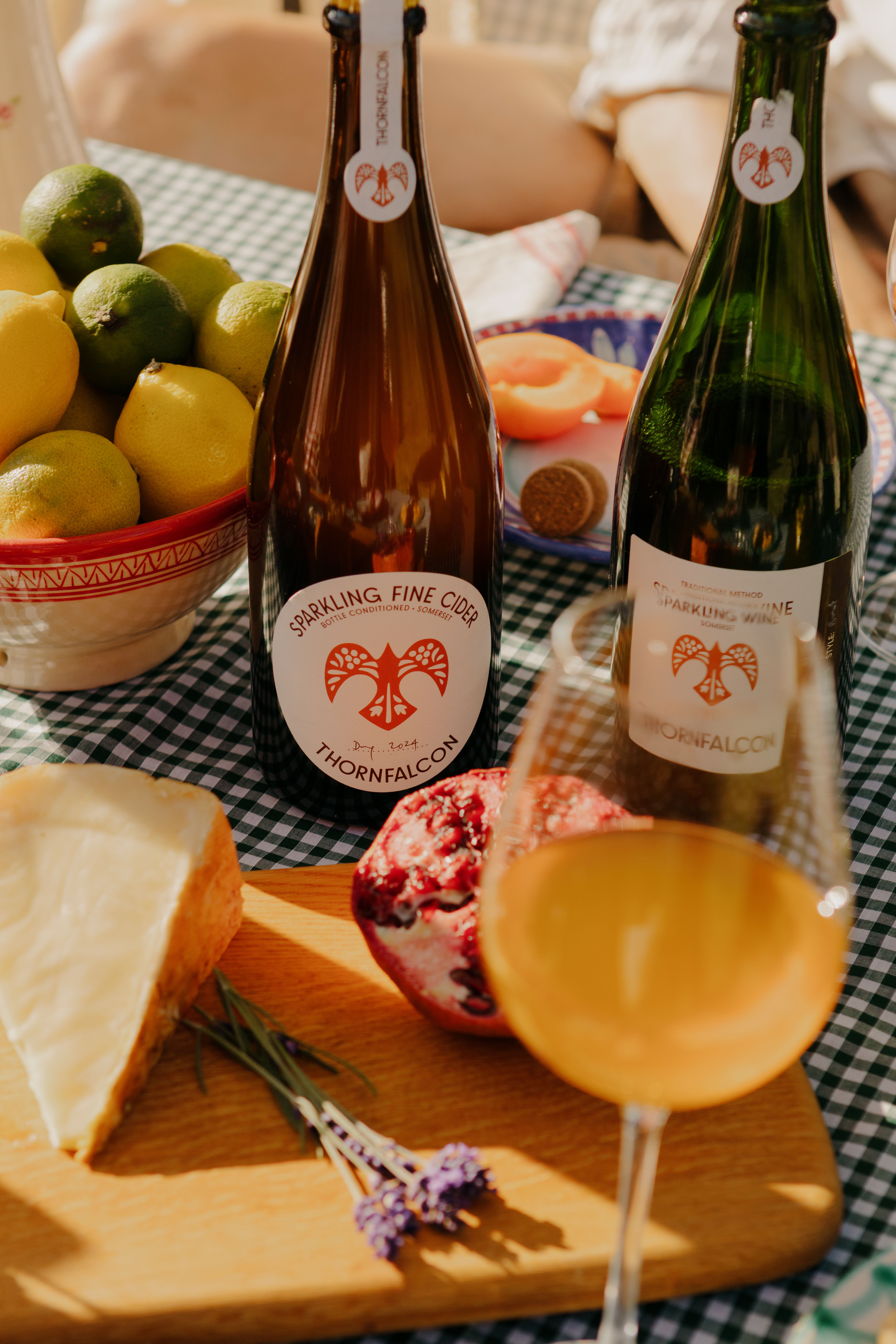 Winemaker Panu Long's sparkling fine cider and sparkling wine from Thornfalcon Winery & Press, served al fresco with cheese and fruit