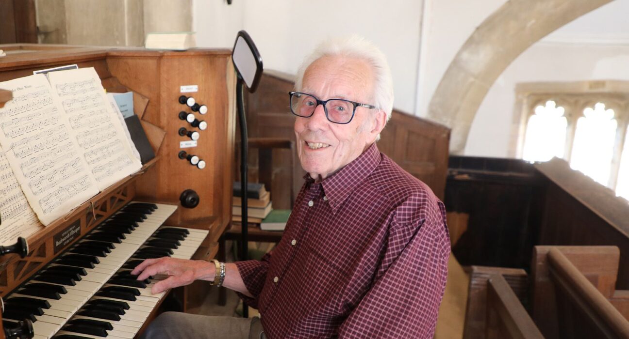 Church organist Keith Watts, 88, sits at the reed organ at Thomas a Becket Church, Lydlinch, where he has played for 73 years