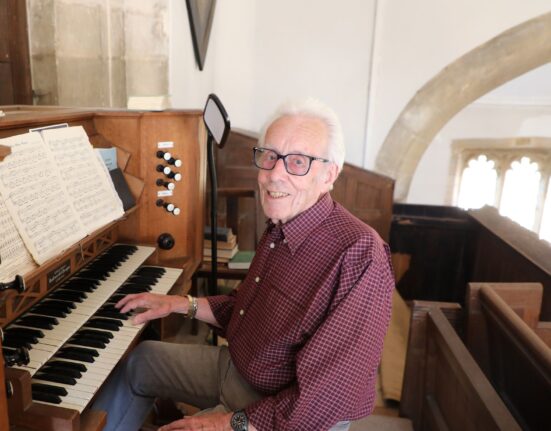Church organist Keith Watts, 88, sits at the reed organ at Thomas a Becket Church, Lydlinch, where he has played for 73 years