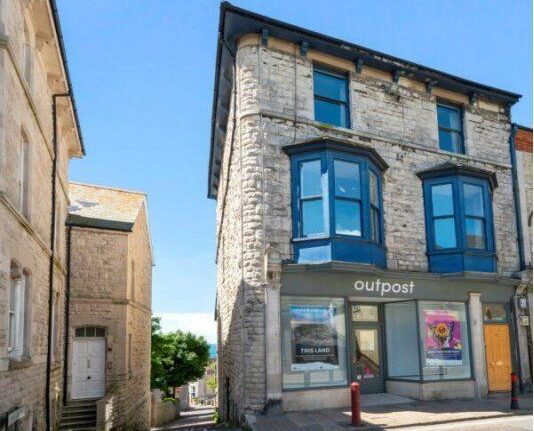 The b-side building on Portland, a three-storey Portland stone corner property with blue bay windows and a shopfront below, which b-side festival is raising funds to buy