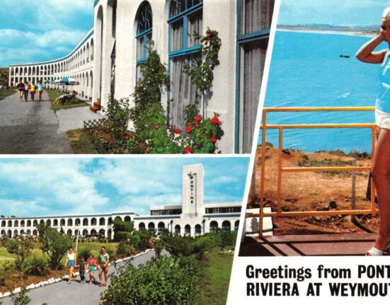 Vintage postcard of the Riviera Hotel Weymouth during its Pontins era, showing the curved white arched façade with blue trim, holidaymakers on the lawns and paths, and a woman posing on a balcony overlooking the sea, with the caption “Greetings from Pontin’s Riviera at Weymouth